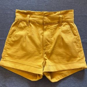 Mustard colored high waisted shorts